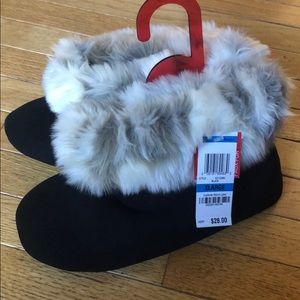 Black furry slippers